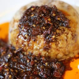 Soft Ewa Agoyin with dark pepper sauce tray